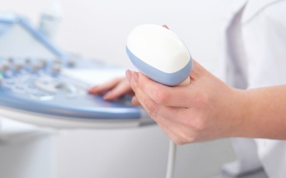 Nurse performing an transabdominal ultrasound