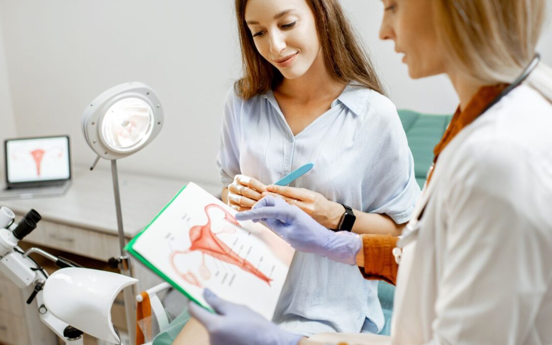 woman reviewing chart with doctor